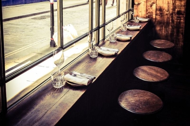 A bar-style table set up by the window at the Enoteca da Luca at St. Paul's